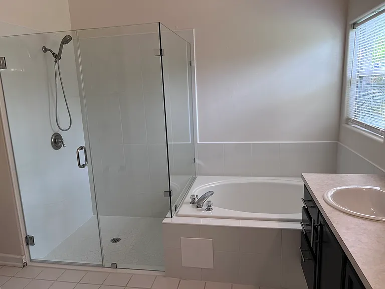 soaking tub and separate shower in en suite bath