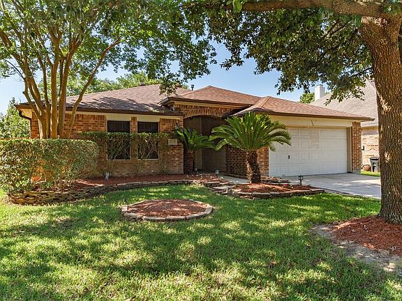 Gorgeous mature landscaping makes the curb appeal here fantastic.