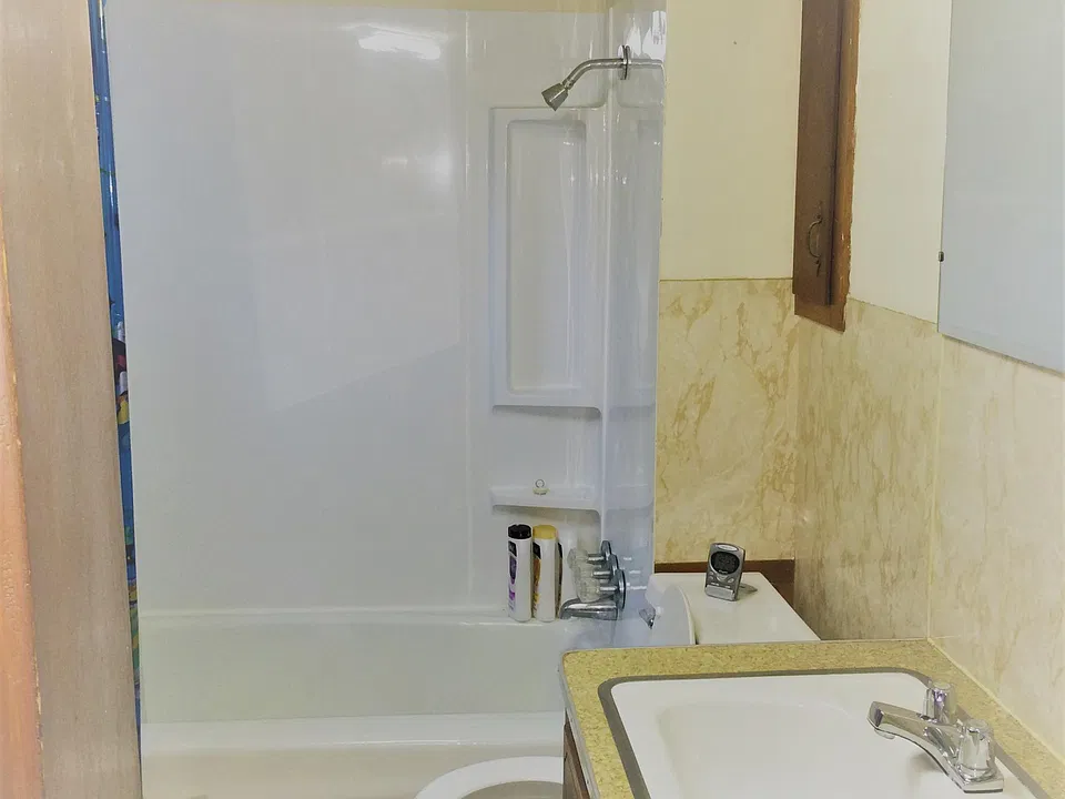 Full bath with tub-shower combo