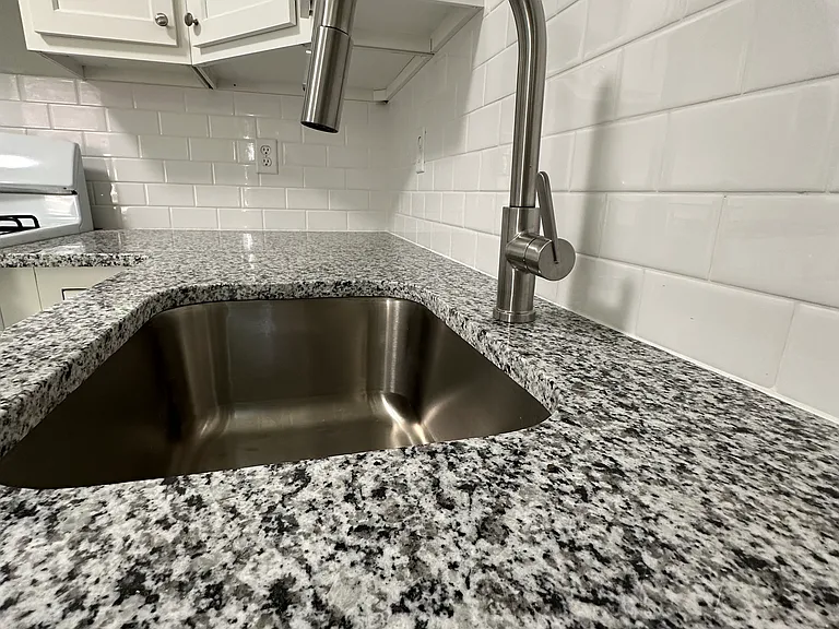New Kitchen Sink and New Granite Counter-Tops.