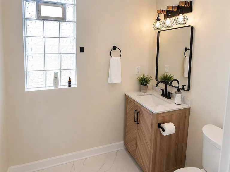 Recently renovated level 1 bathroom with all black hardware.