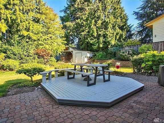 The elevated deck has been removed since this photo due to wear & tear, but the patio still allows you plenty of room to enjoy your private backyard.