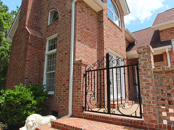 Lighted Stairs & Iron Gate