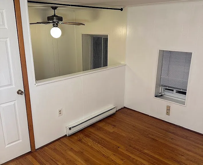 Larger bedroom half wall looking into living room.