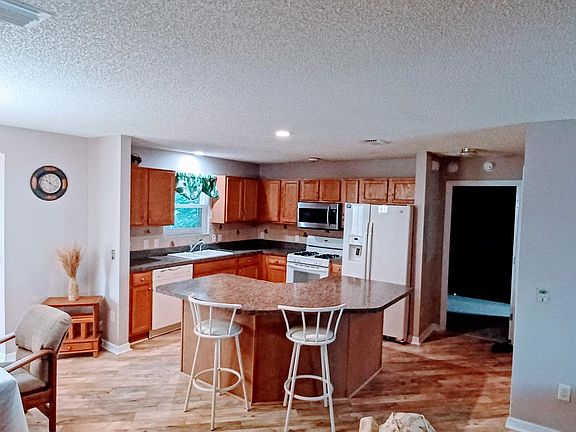 Looking into kitchen and dining room.