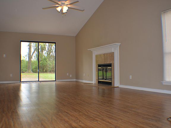 Living Room view to Back Patio and Back Yard. Fireplace Decorative Only.