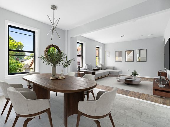 Open concept dining and living area virtually staged