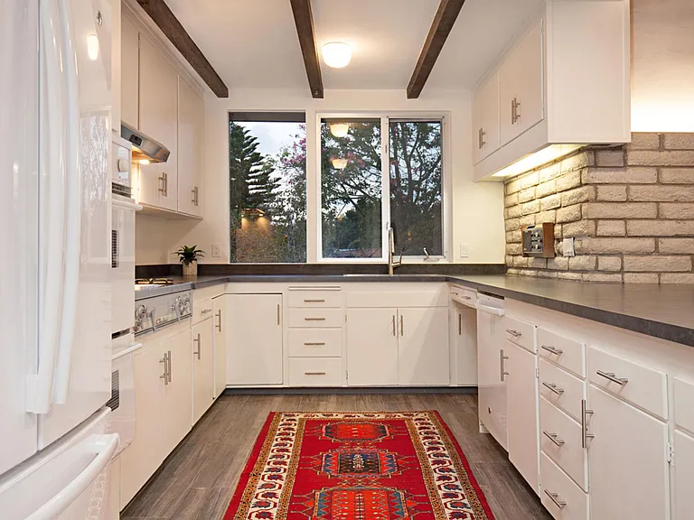 Kitchen with now all stainless appliances Thor commercial range