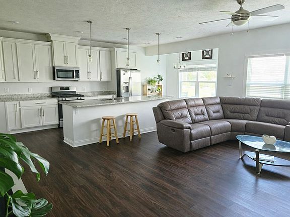 Bright open-concept living and dining area with modern finishes and plenty of natural light