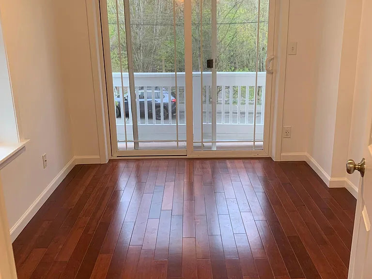 Bedroom 3, with access to the front balcony.