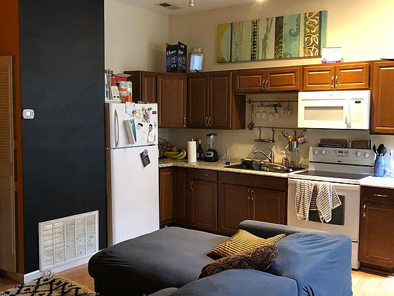 Kitchen and living room as you walk through