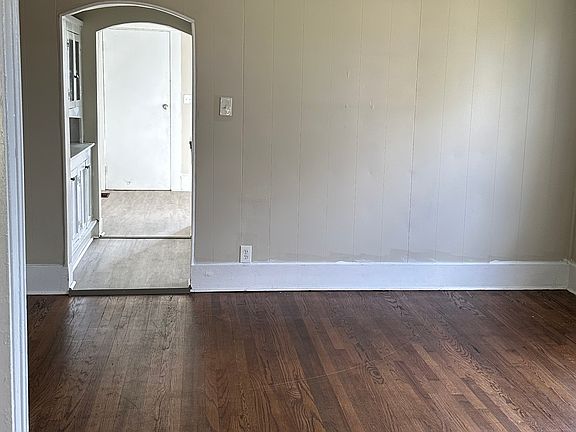 hardwood floors in the dining area & freshly painted walls.