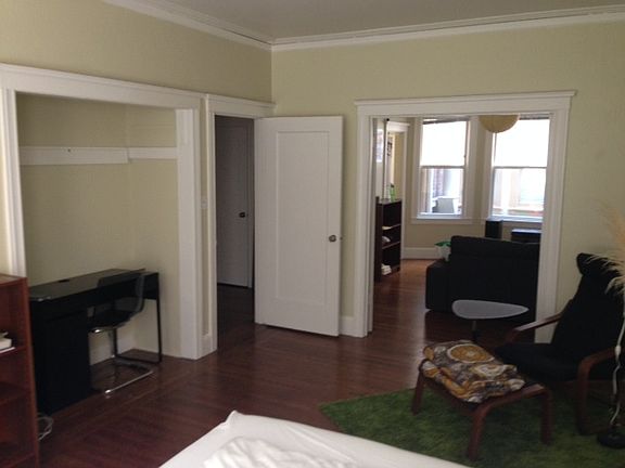 Bedroom. Livingroom is beyond the open French doors.