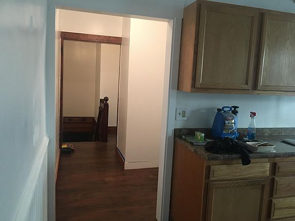 Walkway to storage nook and front stair case