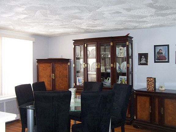 Hardwood Floors in Sunfilled Dining Room and Living Room