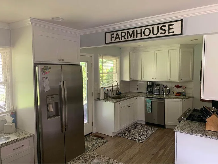 Renovated kitchen with stainless steel GE appliances