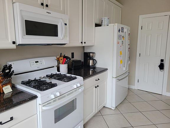 Kitchen with large pantry and ceramic floors