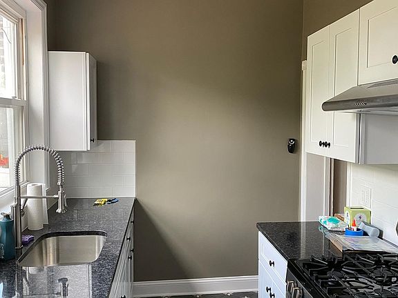 Newly renovated kitchen with the coolest ceiling fan and light we could find! We've installed this same fan in the dining room and both bedrooms.