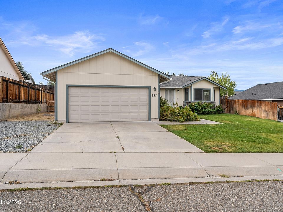 Street View 2 Car Garage with 3rd parking space on gravel driveway