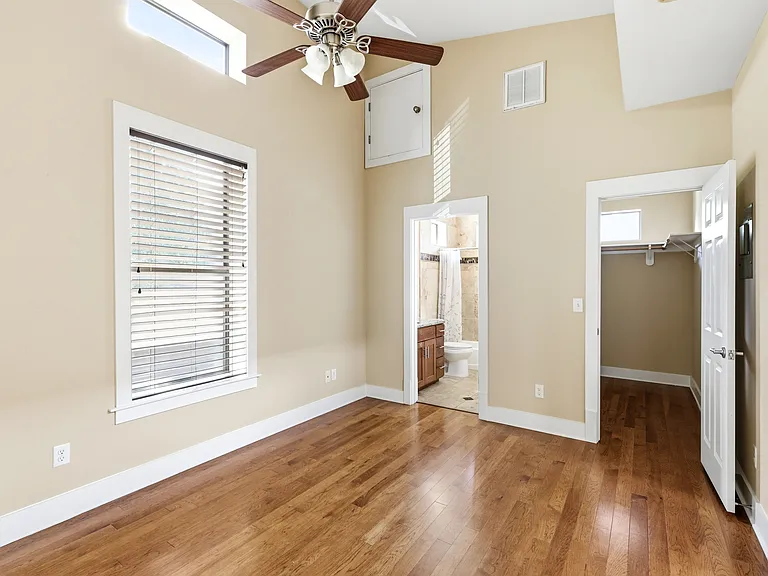 Primary bedroom + bathroom view and spacious closet