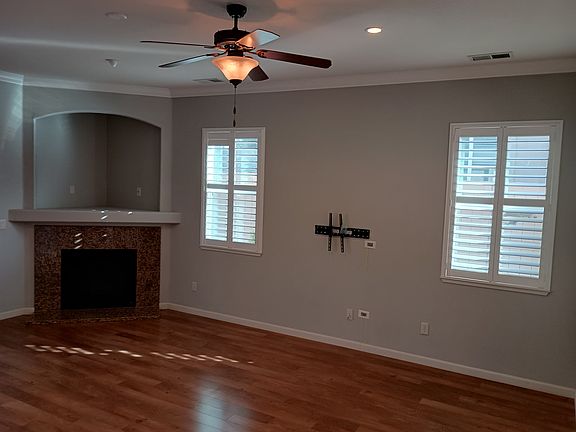 Living room from hallway. Television mount with option to hide cables.