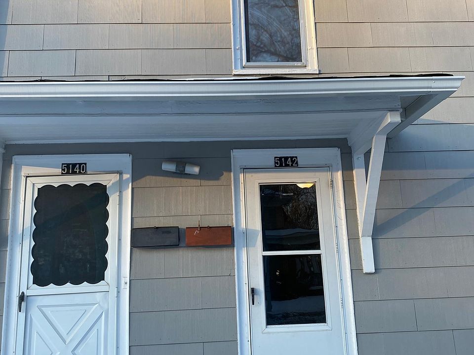 Right side is south main entrance into living room and this is facing Adams Street. House conversion duplex with separate entrances