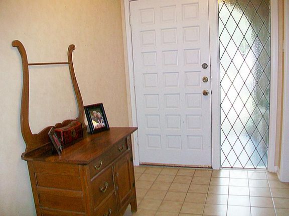 ARCHED & COVERED ENTRY, TILE FOYER