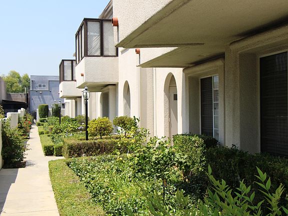 Beautifully landscaped side yard/courtyard front entries to each townhouse. New dual paned windows throughout each townhouse. Great for environmental control and noise surpression.