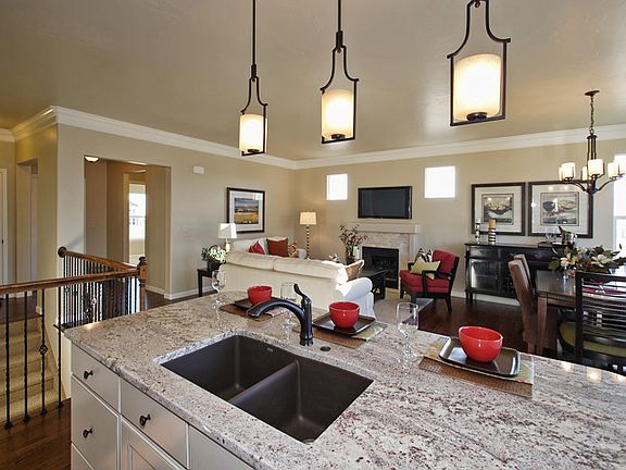 Open kitchen overlooks great room and dining area.