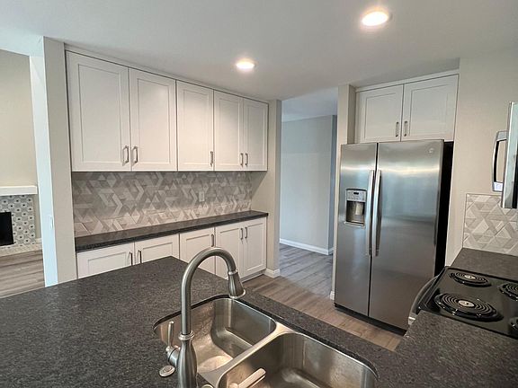 Alternate view kitchen, showcasing the extra counter and storage/pantry space.