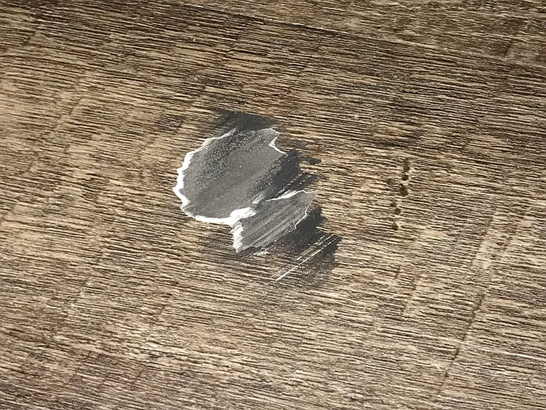 Damaged laminate floor in livingroom
