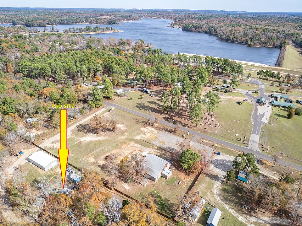 Aerial showing proximity to Lake Hawkins - pad site is empty (RV in photo is former tenant)