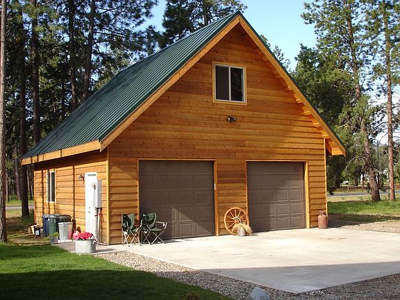 Home features 2-car detached garage/shop w/bonus area above.