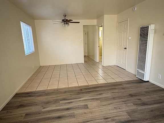Living Room/Dinning Area has 2 large windows for bright natural lighting. Brand new flooring and wall mount heater.
