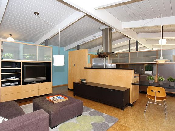 Family Room with high ceilings and contemporary touches