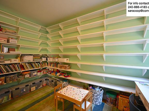 Office (or optional 5th bedroom) with built-in wall to wall bookshelves. Hardwood flooring.