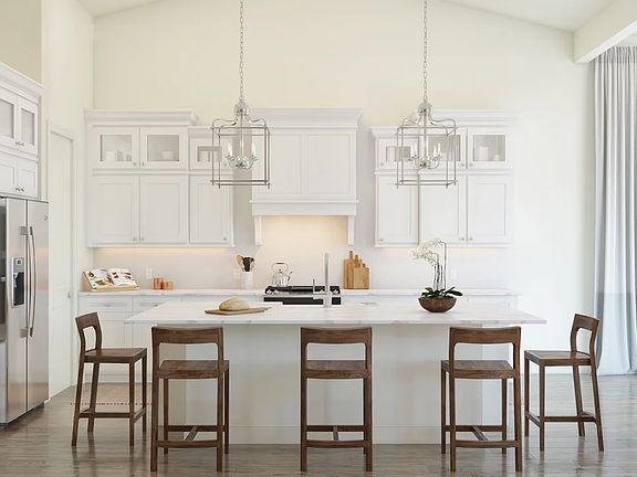 Kitchen with pendant lighting and glass upper cabinets