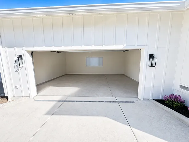 Oversized 2-car garage with abundant space for parking, storage, and workshop use.