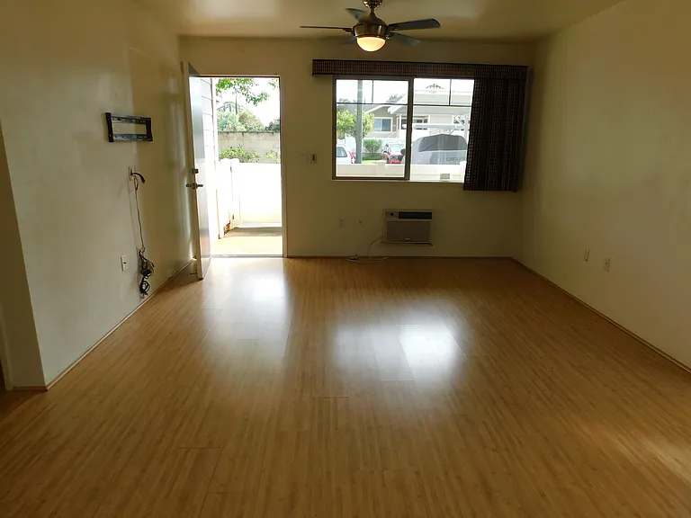 From kitchen to front door/lanai. Window a/d and ceiling fan.