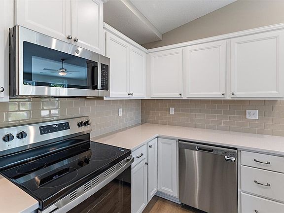 Modern stone countertops and sleek cabinetry eleva