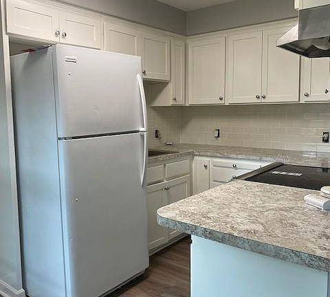 Kitchen features subway tiles, new formica and lights. Stainless new stove and hood. Fridge is almost new too