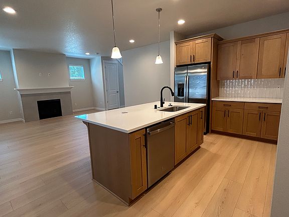 Open concept layout w/ large kitchen island w/ room for seating