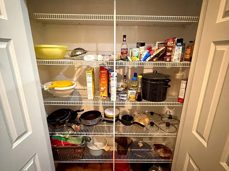 Pantry adjacent to kitchen