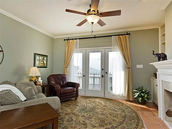 Lots of natural light with built in cabinents surrounding the fireplace.