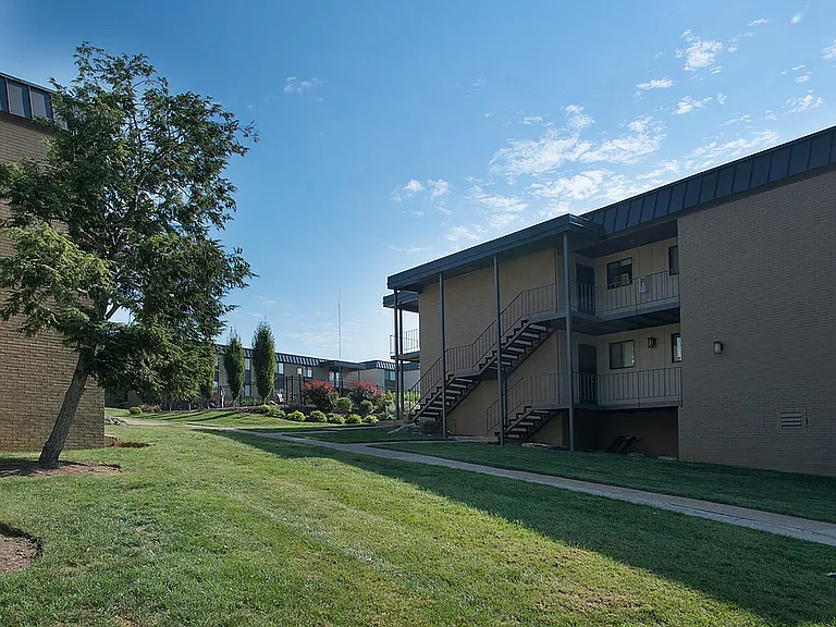 Explore this inviting apartment community, nestled in a serene landscape.