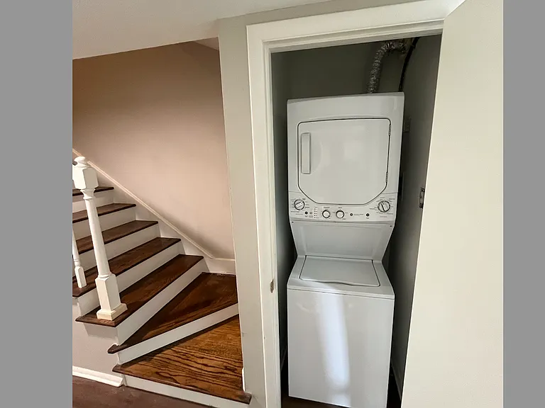 Brand-new laundry hutch is vented to outdoors, across from kitchen, and comes with stand-up washer-dryer