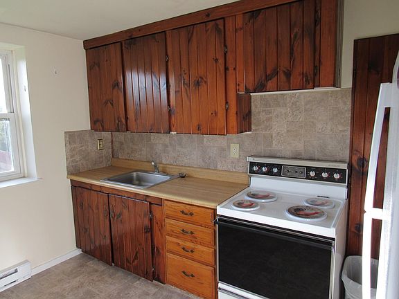 Kitchen with new faucet, floor, backsplash, spacious cabinets and pantry