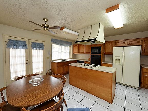 You'll enjoy gas cooking and the great counter space in this island kitchen!  Refrigerator is included!