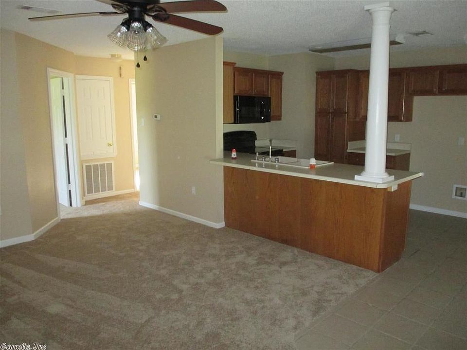 kitchen includes all appliances including refrigerator and a above stove microwave oven.