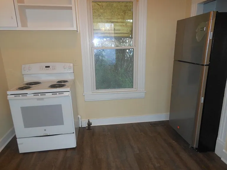 Kitchen, new range and oven, new refrigerator. New vinyl plank floor.